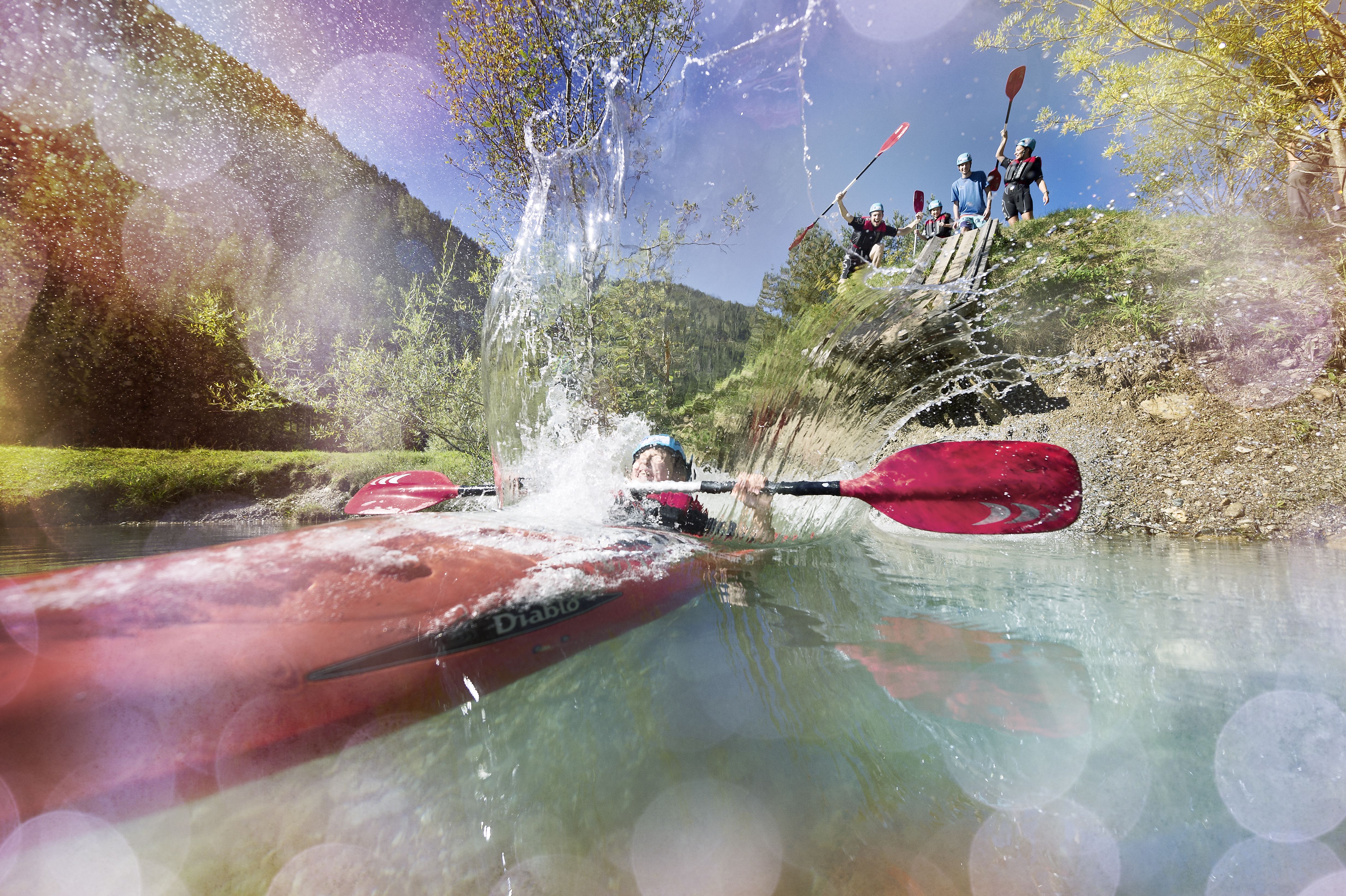 <p>Refreshing cooling off at the kayak slide at the bathing lake in Flachauwinkl</p>