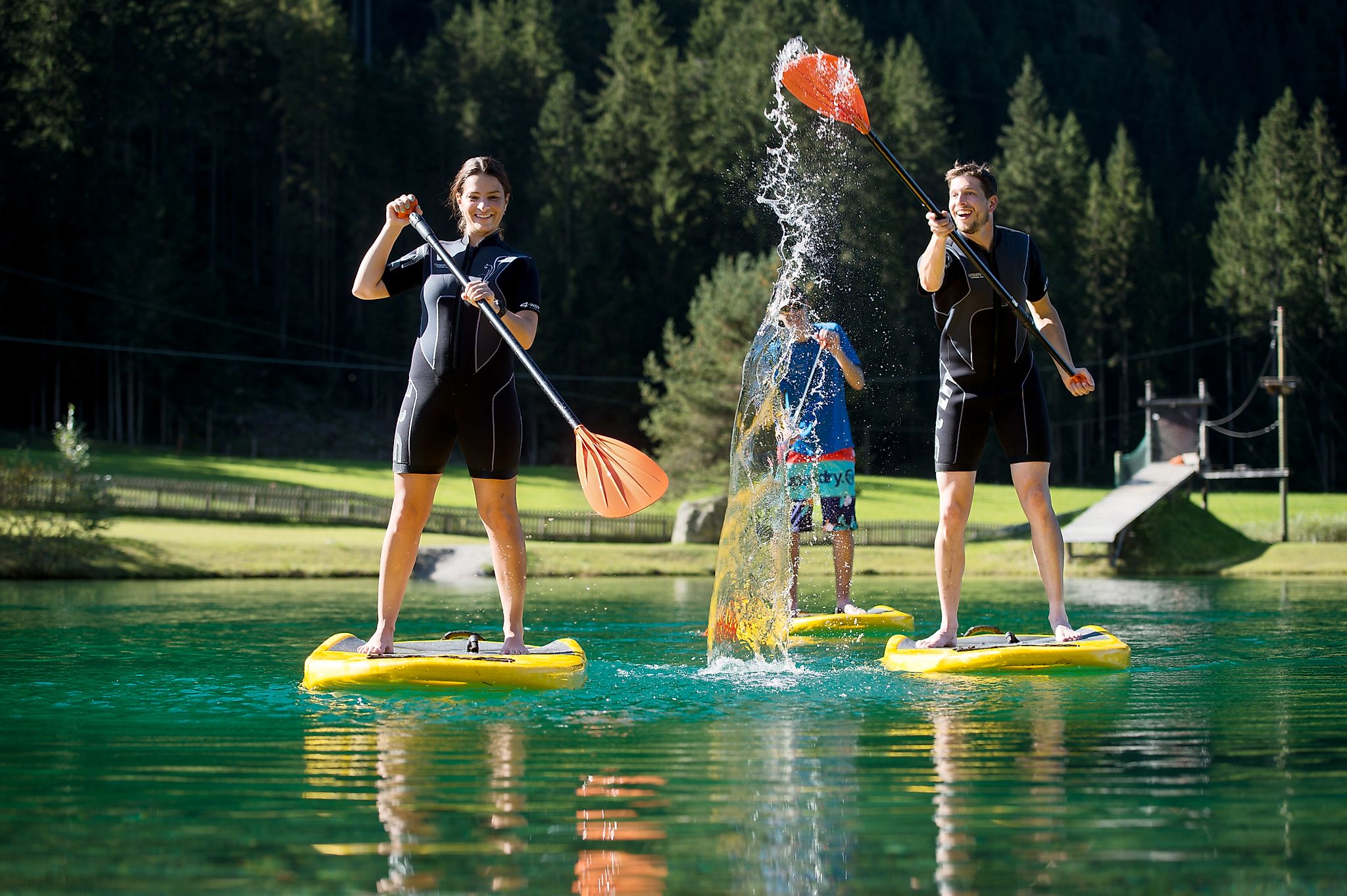 <p>Stand Up Paddling with the family at the swimming lake in Flachauwinkl.</p>
